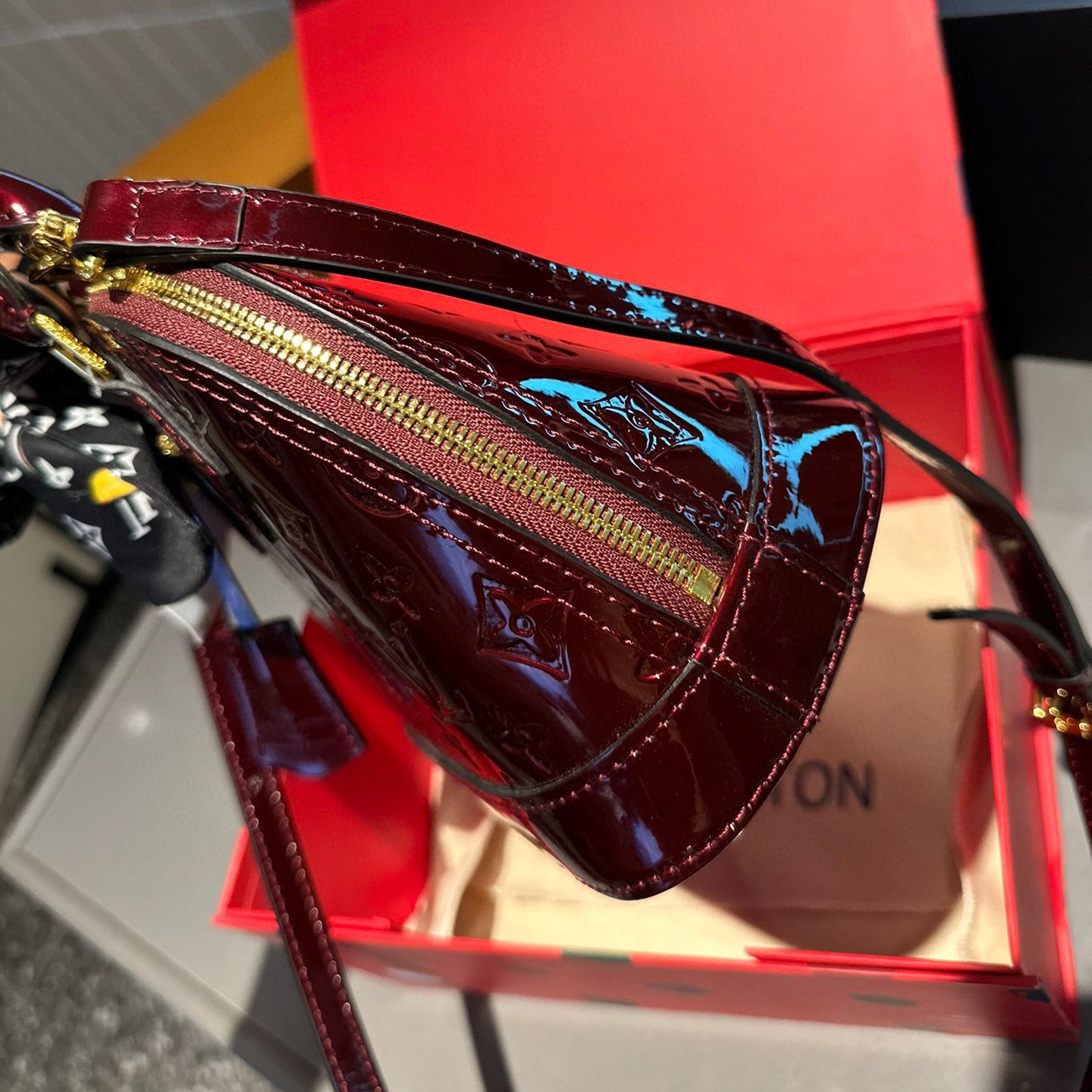 Embossed bright leather Alma shell bag 1824041702