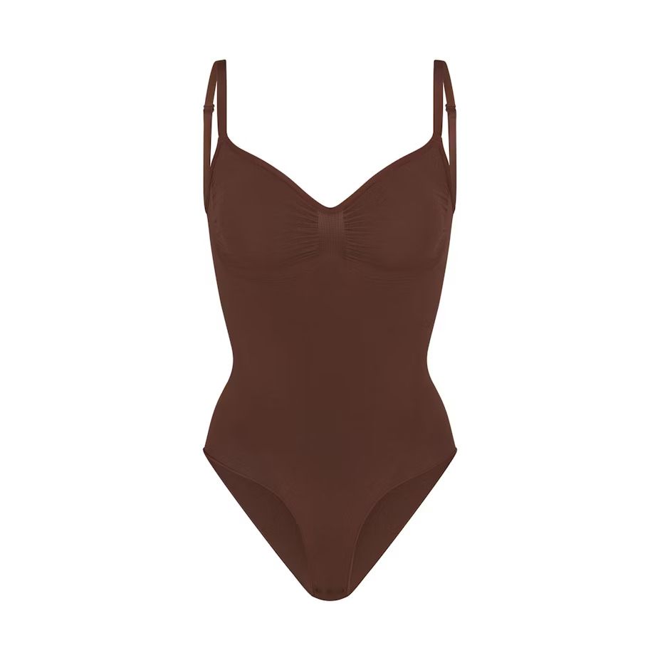 Skims Kardashian with the same sexy non-marking one-piece shapewear waist belly triangle hip thong